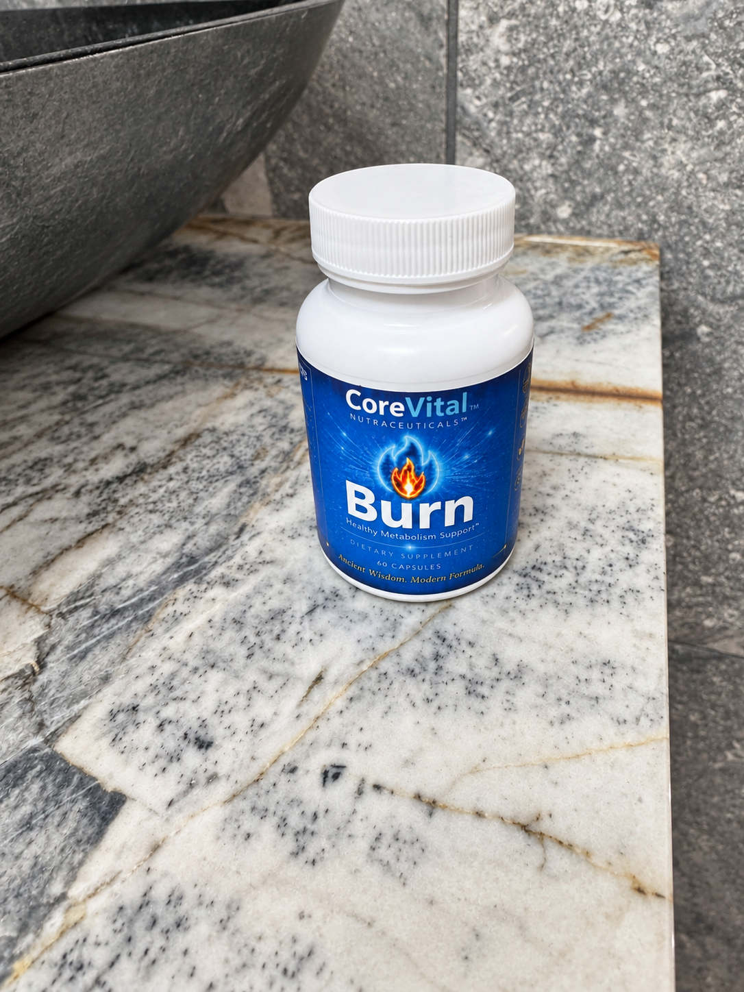 CoreVital Burn bottle on a light stone surface